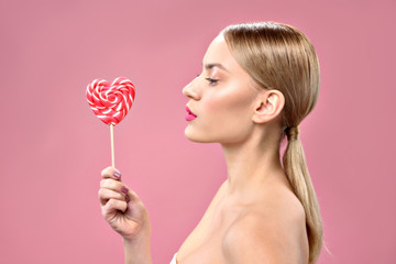 Pretty girl posing with color sweetmeat