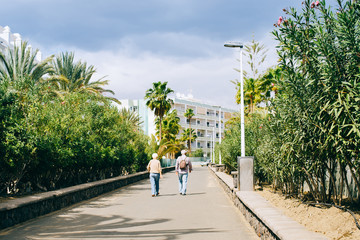 Two pensioners go to their hotel during the holiday, Spain