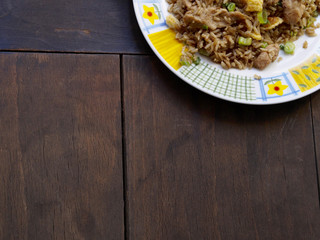 Chicken chaufa rice on wood background