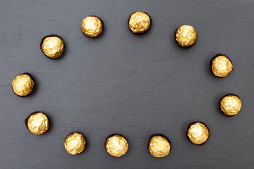 Truffles pattern, top view flat lay of various chocolate sweets. Minimal concept above decoration on black food background. Chocolate Candy, Truffle.