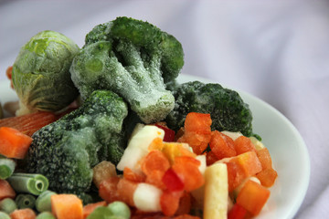 Frozen vegetables on a white plate