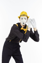 Man, Artist, MIME holding hand near ear and listened. the expression of human emotions and the concept of lifestyle. On a white Studio background.
