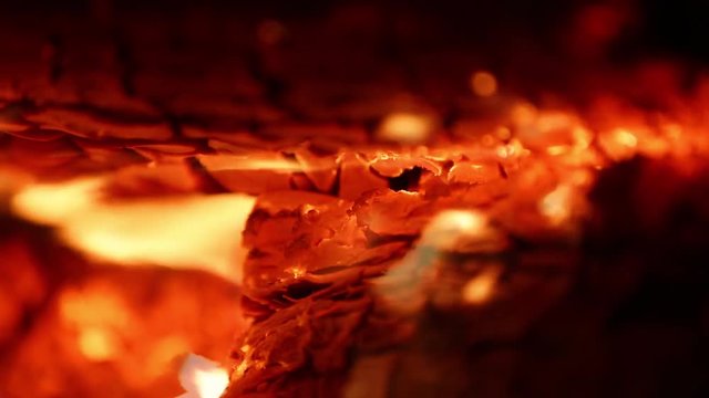 Burning wood in a stove close up