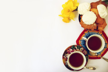 Black tea and biscuits on a light background