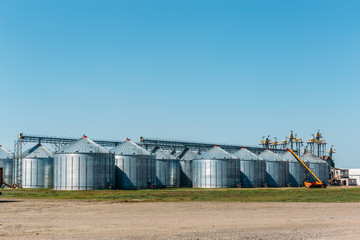 Fototapeta na wymiar Big industrial Silo Storage Tanks on blue sky background