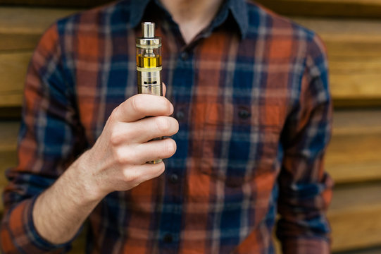 Electronic cigarette in hand