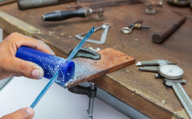 goldsmith making wax mold for jewelry