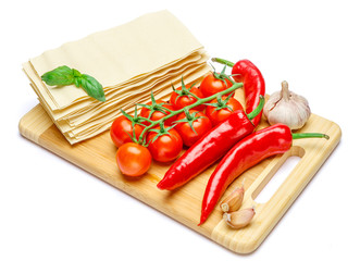 dried uncooked lasagna pasta sheets and vegetables