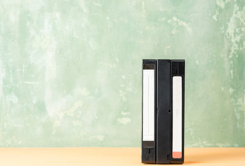 VHS videotapes  on a green background