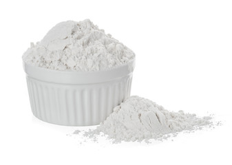 Bowl of white flour isolated on white background