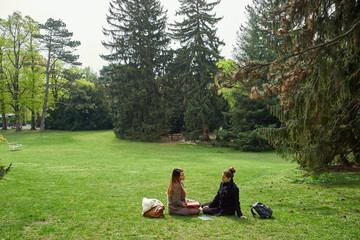 Two female students in a park