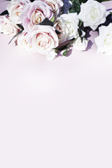 Pink and white roses on pink background