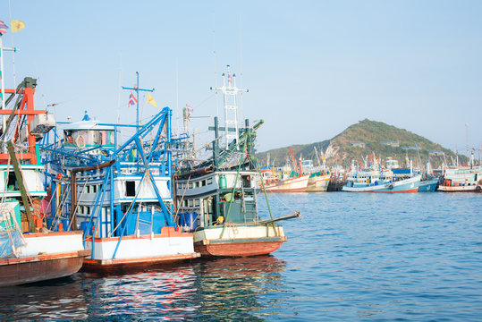 Fishing boats to recreational fishing are moored in the harbor at  Chonburi, Thailand