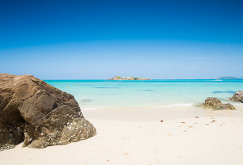 Stone on Sea beach blue sky sand sun daylight relaxation at samaesarn island, Thailand.