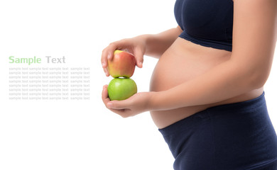 Pregnant woman holding green and red apple on isolate white background,Healthy Food Concept