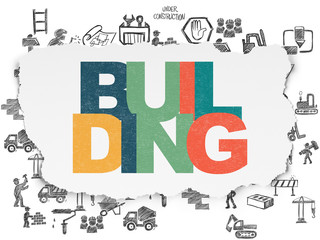Construction concept: Building on Torn Paper background