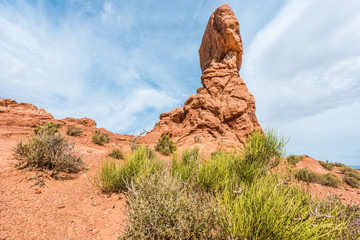 Fototapeta na wymiar Tall red balanced rock in Arches National Park in canyons
