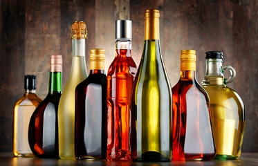 Photo sur Aluminium Bar Bottles of assorted alcoholic beverages