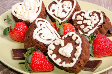 Heart shaped chocolate muffins and raspberries