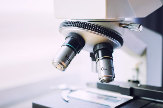 medical laboratory, scientist hands using microscope for chemistry test samples,examining samples and liquid,Medical equipment. microscope,Scientific and healthcare research background.vintage color