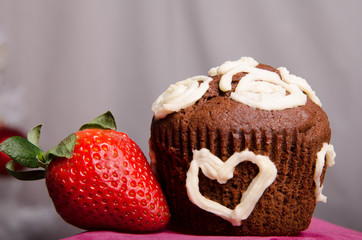 Heart shaped chocolate muffins and raspberries