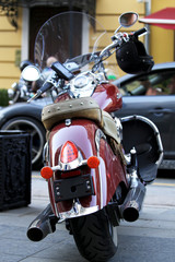 Old vintage motorcycle with chrome accents and a headlamp
