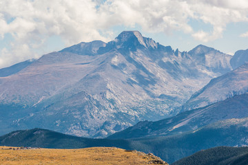 Rocky Mountains in Colorado with people at parking lot overlook