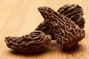 Morel mushroom on wooden background