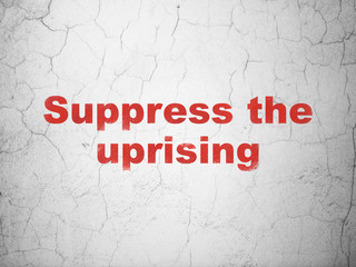 Political concept: Suppress The Uprising on wall background