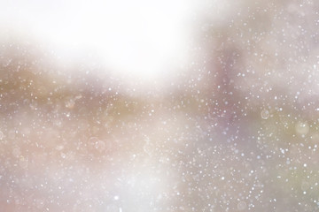 Snowfall texture of snowflakes on blurred background