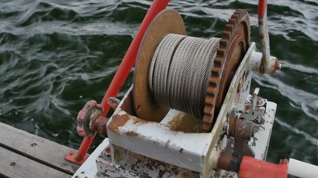 Anchor windlass mechanism with chain on ship deck