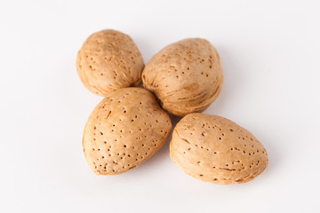 Whole almonds nuts isolated on white background
