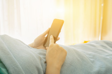 patient Relaxing With Tablet pc, contact with doctors, medical services, emergency call. woman...