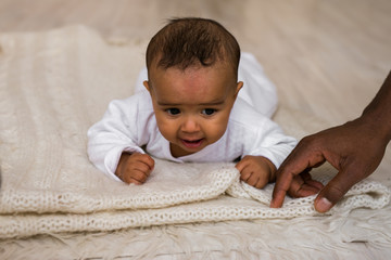 African American Father Playing With mixed race Baby Son