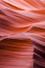 Obraz premium Dark orange wave shapes photographed at slots canyons sunset in Arizona.