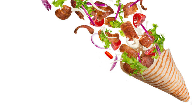 Kebab sandwich with flying ingredients.