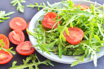 tomatoes with fresh arugula