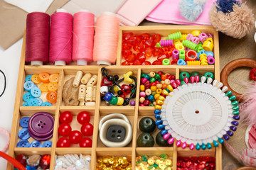 Fototapeta premium set of accessories and jewelry to embroidery, sewing accessories top view, seamstress workplace, many object for needlework, embroidery, handmade and handicraft