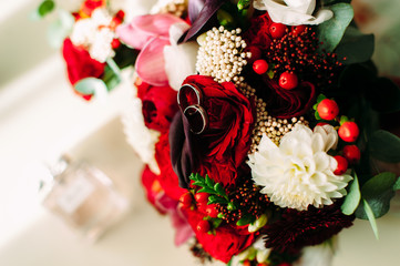 wedding rings on red colors