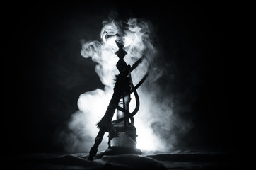 Hookah hot coals on shisha bowl with black background. Stylish oriental shisha