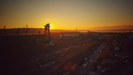 Varna, Bulgaria. Beautiful sunset over industrial city area.