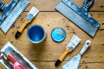 building implements set for repair on wooden background top view