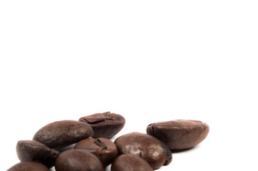 Few coffe beans on white background letter space