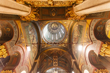 Fototapeta na wymiar Ornate / rich decorated ceiling and dome of the Patriarchal cathedral in Bucharest, Romania