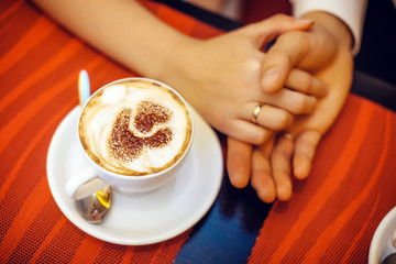 Lovely couple. cup of coffee