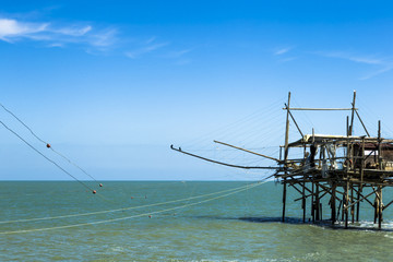 Fototapeta na wymiar Fishing platform known as trabucco in San Vito Chietino, Abruzzo, Italy