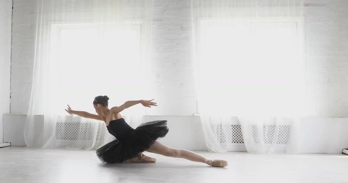 graceful girl practicing ballet in the Studio