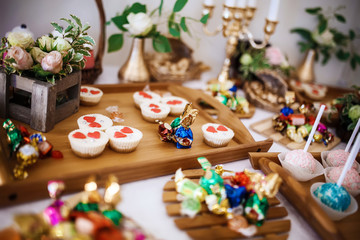 cakes, macaroon and cookies on the sweet table