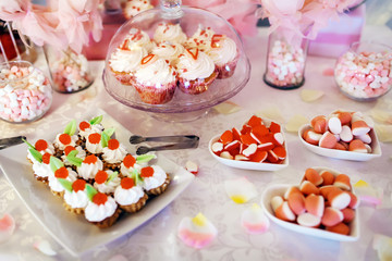 cakes, macaroon and cookies on the sweet table