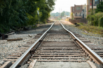 Fototapeta na wymiar Railroad tracks with a shallow depth of field and vanishing perspective